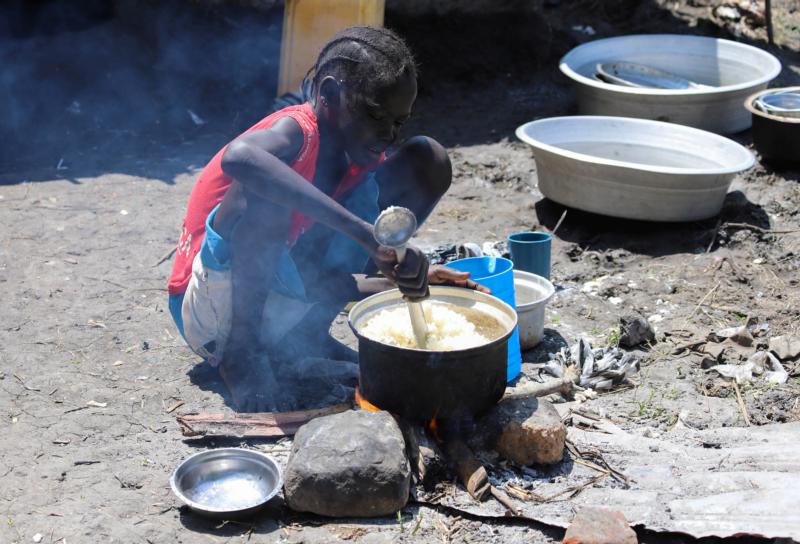 A child prepares a meal outside a makeshift shelter Nov. 1, 2019, in Gumuruk, South Sudan. A negligent and selfish culture of food waste is fueling the global hunger crisis, damaging the lives of individuals, and preventing the progress of all people, Pope Francis said Nov 18. (CNS photo/Samir Bol, Reuters) See POPE-WFP-INEQUALITY Nov. 19, 2019.