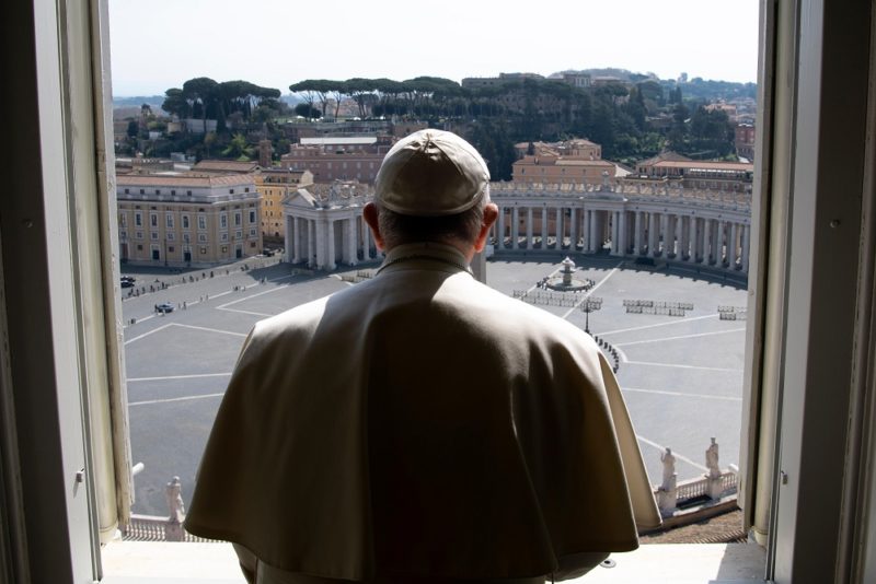 Pope Francis looks over an empty St. Peter's Square after leading a livestream of the recitation of the Angelus from the library of the Apostolic Palace March 22, 2020. The pope announced he will give an extraordinary blessing "urbi et orbi" (to the city and the world) at 6 p.m. Rome time March 27 in an "empty" St. Peter's Square because all of Italy is on lockdown to prevent further spread of the coronavirus. (CNS photo/Vatican Media) See POPE-EXTRAORDINARY-BLESSING March 22, 2020.