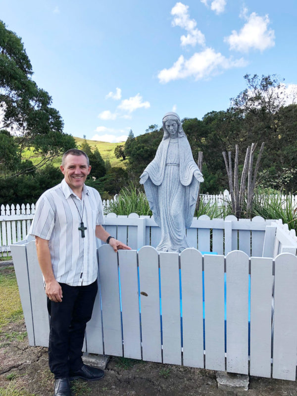 Bishop Michael Gielen with a statue of Our Lady at Motuti.

