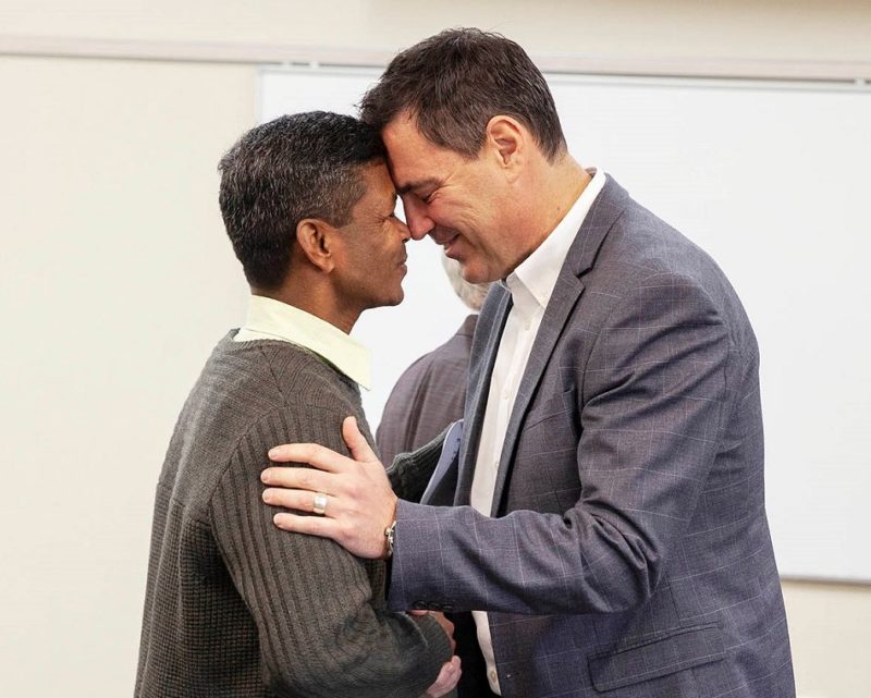 Liam Greer (right) meets Fr Vijay Dung Dung at the welcome (Photo: Emma Dodsworth)

