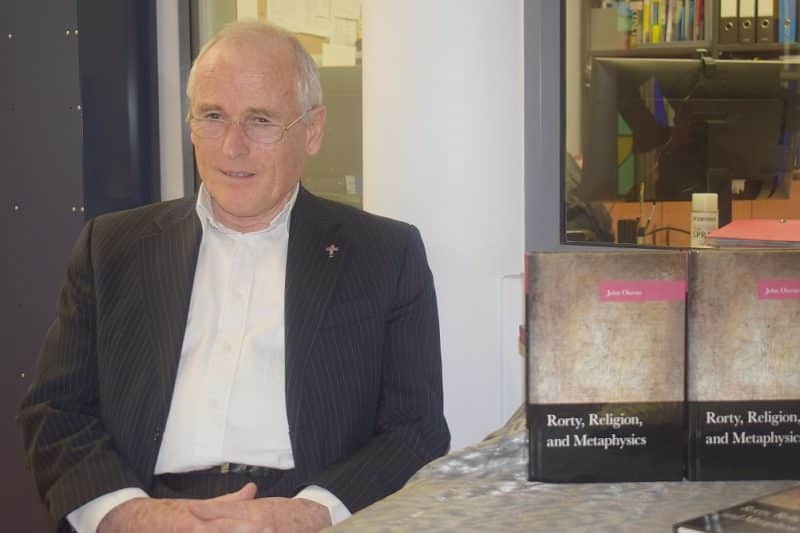 Fr John Owens, SM, with his book