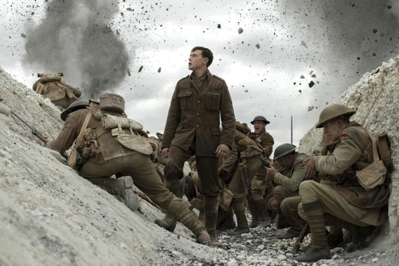 George MacKay, center, stars in a scene from the movie "1917." The Catholic News Service classification is A-III -- adults. The Motion Picture Association rating is R -- restricted. Under 17 requires accompanying parent or adult guardian. (CNS photo/Universal) See MOVIE-REVIEW-1917 Jan. 9, 2020.