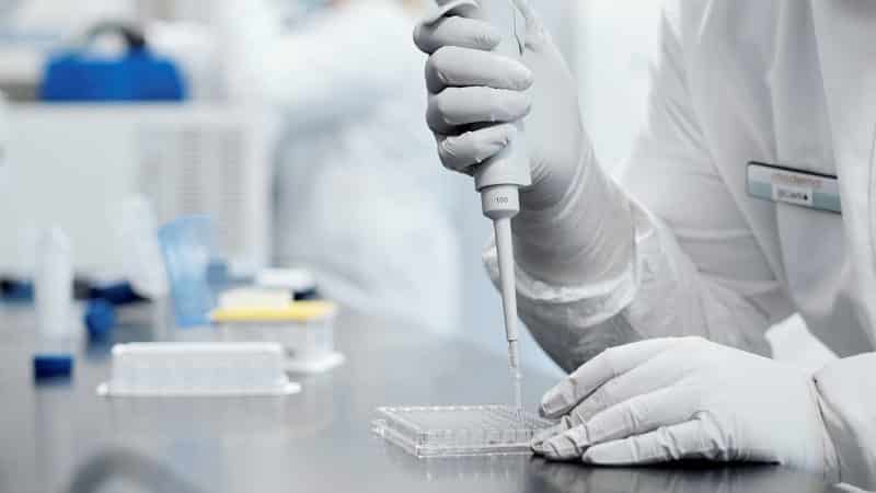 A researcher works in a lab run by Moderna Inc., who announced Nov. 16, 2020, that its experimental vaccine was 94.5% effective in preventing COVID-19. (CNS photo/Moderna Inc. via Reuters) Editor's note: One time use only. No archives.