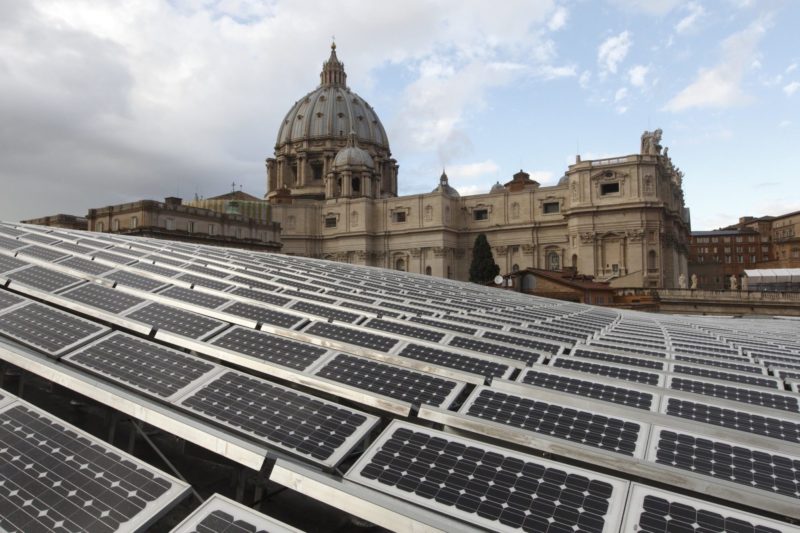 Solar panels are seen on the roof of the Paul VI audience hall at the Vatican in this Dec. 1, 2010, file photo. In a videomessage, Pope Francis told the Virtual Climate Ambition Summit that Vatican City is aiming for net zero carbon emissions. (CNS photo/Paul Haring)