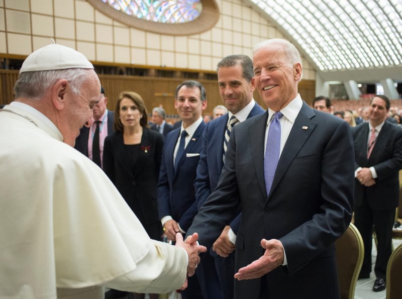Pope Francis greets U.S. Vice President Joe Biden after both spoke at a conference on adult stem cell research at the Vatican April 29, 2016. The pope sent a written message to Biden upon his Jan. 20 inauguration as president of the United States. (CNS photo/Vatican Media)