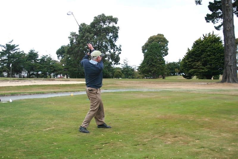 Bishop Dooley tees off
