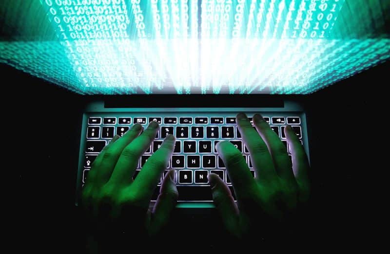 A person types on a computer keyboard in this 2013 photo illustration. A website called the Wisconsin Catholic Tribune that is part of a Chicago-based network has been found to be using content from diocesan newspapers without permission.  (CNS photo/Kacper Pempel, Reuters) See WEBSITE-DIOCESAN-STORIES to come.
