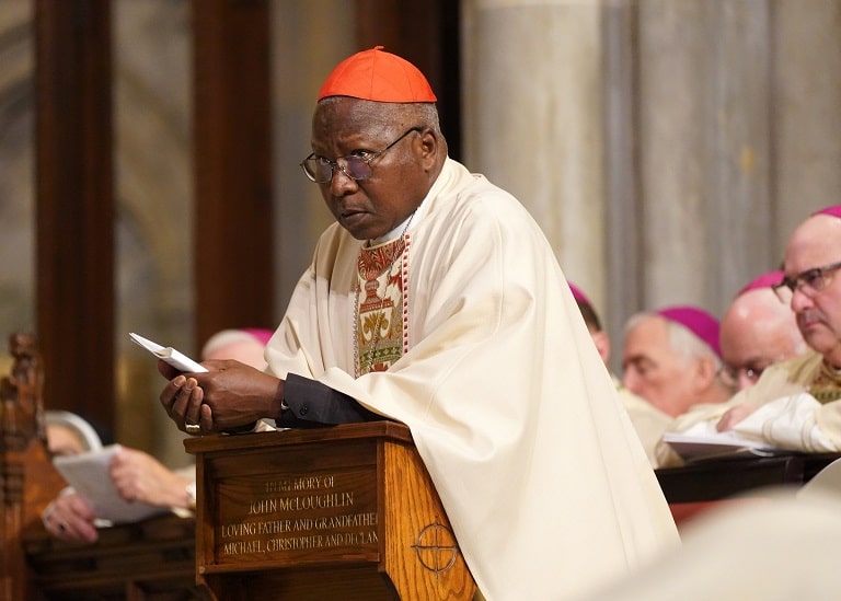 Cardinal Philippe Ouédraogo of Ouagadougou, Burkina Faso, kneels in the sanctuary at St. Patrick's Cathedral in New York City in 2019. The cardinal has denounced the imposition of "foreign ideologies" across Africa and urged its citizens to seek modernization without succumbing to Western influences that erode family bonds. (CNS photo/Gregory A. Shemitz)