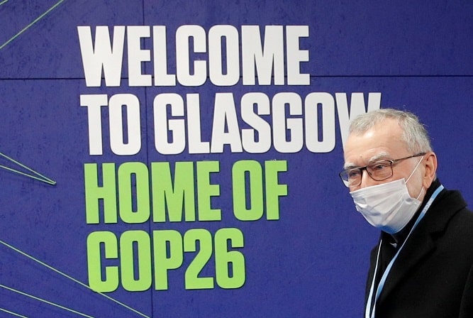Cardinal Pietro Parolin, Vatican secretary of state, arrives for the U.N. Climate Change Conference, COP26, in Glasgow, Scotland, Nov. 1, 2021. Cardinal Parolin, who leading the Vatican delegation to the conference, said the COVID-19 pandemic has shown a need for a "change of direction" in addressing the climate crisis by strengthening "the covenant between human beings and the natural environment." (CNS photo/Phil Noble, Reuters pool)