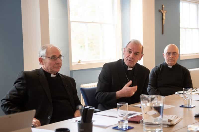 Auxiliary Bishop Paul McAleenan of Westminster, Bishop Paul Mason of the Bishopric of the Forces and Father Christopher Thomas, general secretary of the Bishops' Conference of England and Wales, attend a news conference in London Nov. 19, 2021. The bishops announced a delay in their plans to restore the obligation to go to Mass on Sundays because of the continuing COVID-19 pandemic. (CNS photo/Marcin Mazur, courtesy Bishops' Conference of England and Wales)