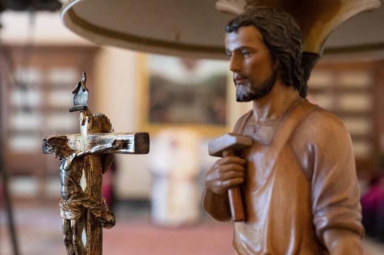 A crucifix and a statue of St. Joseph are seen as Pope Francis leads his general audience at the Vatican in this Aug. 26, 2020, file photo. In a Dec. 8 apostolic letter, Pope Francis proclaimed a yearlong celebration dedicated to St. Joseph, foster father of Jesus. (CNS photo/Vatican Media)