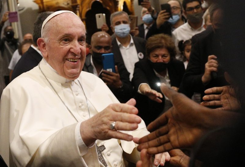 Pope Francis greets people as he leaves an ecumenical prayer with migrants in the Church of the Holy Cross in Nicosia, Cyprus, Dec. 3, 2021. (CNS photo/Paul Haring)