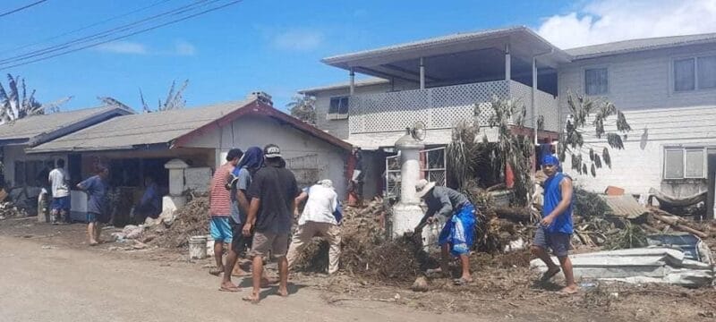 People clean debris following a volcanic eruption and tsunami in Nuku'alofa, Tonga, Jan. 18, 2022, in this picture obtained from social media. (CNS photo/courtesy of Marian Kupu/Broadcom Broadcasting FM87.5 via Reuters) THIS IMAGE HAS BEEN SUPPLIED BY A THIRD PARTY. MANDATORY CREDIT.