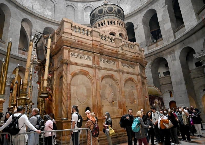 Tourists visit the dome of the Edicule, the traditional site of Jesus' burial and resurrection, at the Church of the Holy Sepulcher in Jerusalem's Old City April 3, 2022. With Palestinian-Israeli tensions rising, three religions prepare to celebrate holidays of Easter, Ramadan and Passover after two years of pandemic restrictions. (CNS photo/Debbie Hill)