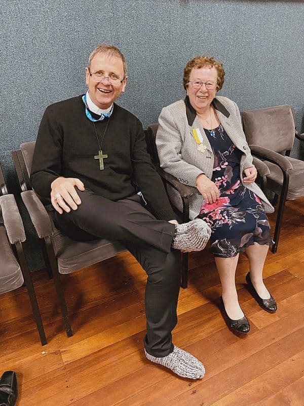 Bishop Stephen Lowe enjoying slippers made by Toni van Bysterveldt