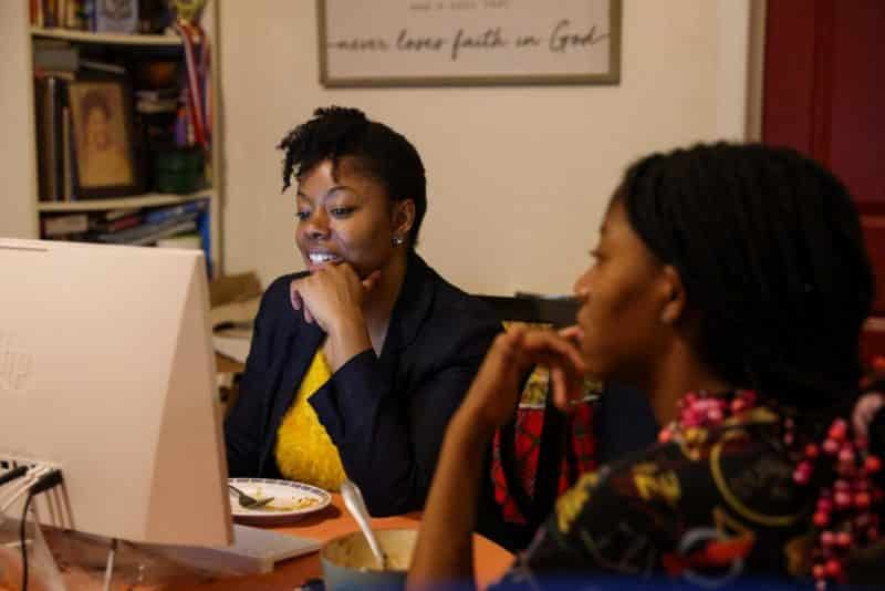 A woman in New York City works on her computer Oct. 17, 2021. This year's annual Labor Day statement from the U.S. bishops touts two bills awaiting action in Congress as being helpful to children, women and families. (CNS photo/Caitlin Ochs, Reuters)