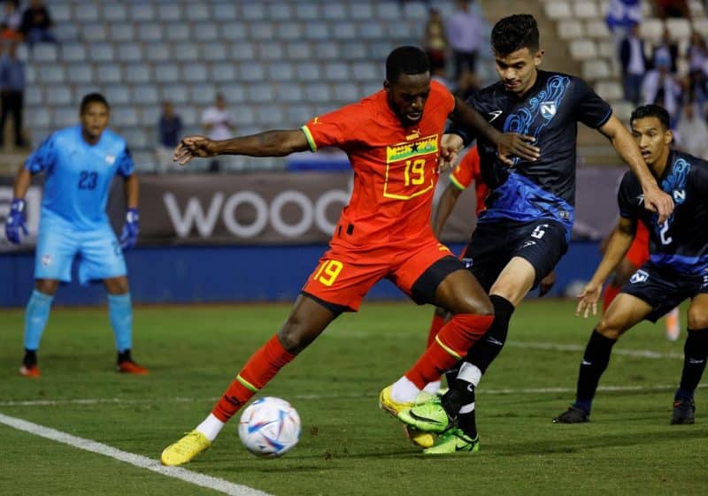 Striker Iñaki Williams of Ghana  battles for the ball against Nicaragua's Marvin David Fletes during an international friendly  in Lorca, Spain, Sept. 27, 2022. (CNS photo/Susana Vera, Reuters)