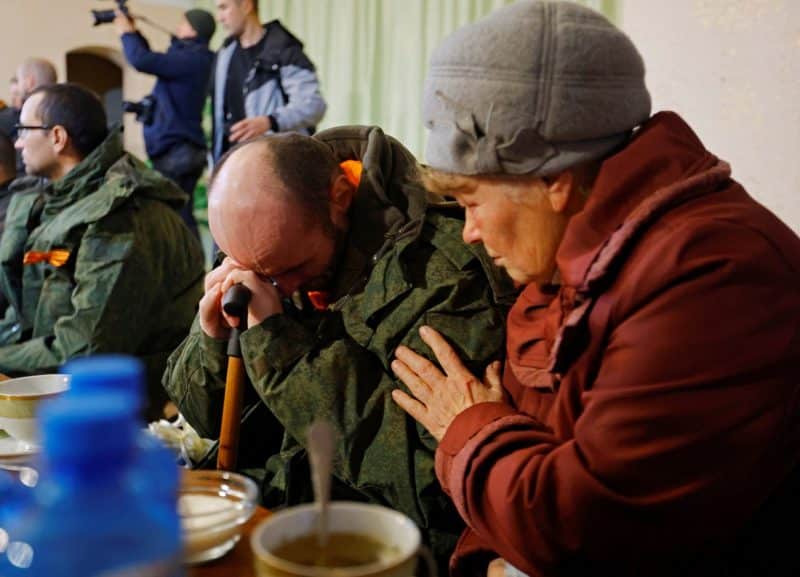 A serviceman from the Russian-controlled Donetsk region of Ukraine sits with his mother in Amvrosiivka, Ukraine, Nov. 6, 2022, following his release in a recent prisoner exchange. Aleksandr Avdeyev, Russian ambassador to the Holy See, confirmed that Pope Francis helped facilitate recent prisoner exchanges with Ukraine and said the Vatican is ready to act as a mediator between Ukraine and Russia. (CNS photo/Alexander Ermochenko, Reuters)