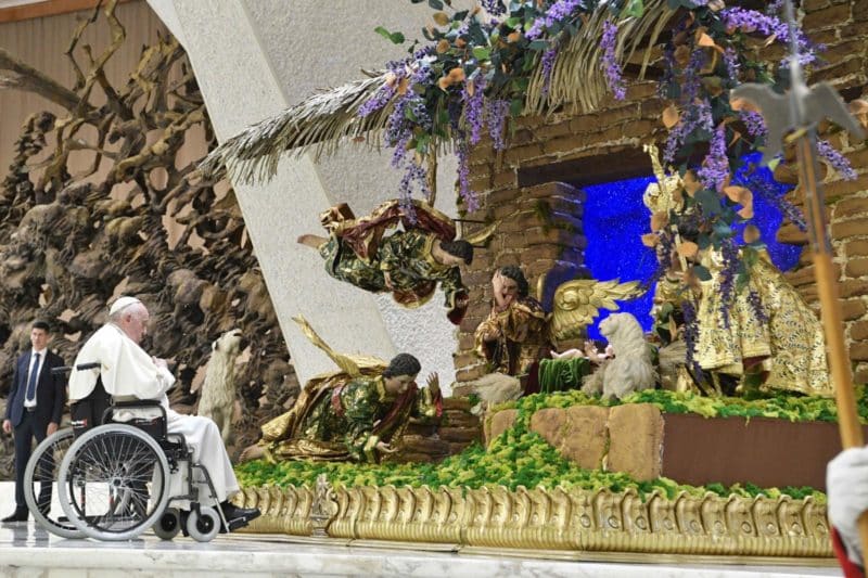 Pope Francis visits a Nativity scene during an audience with the donors of the Vatican Christmas tree and the Nativity scenes, in the Paul VI hall at the Vatican Dec. 3, 2022. (CNS photo/Vatican Media)