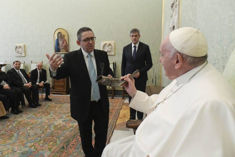 Pope Francis receives a shofar from Rabbi Ariel Stofenmacher, rector of the Latin American Rabbinical Seminary, during an audience with a delegation from the seminary at the Vatican Dec. 2, 2022. (CNS photo/Vatican Media)