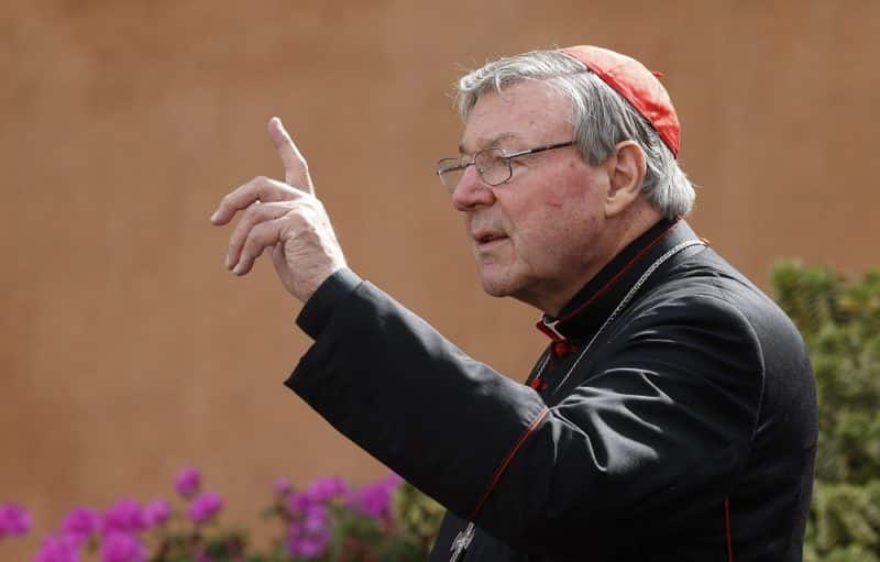 Australian Cardinal George Pell gestures as he leaves a session of the extraordinary Synod of Bishops on the family at the Vatican in this Oct. 13, 2014, file photo. The Spectator, a British magazine, published an article they said was submitted by Cardinal Pell shortly before he died criticizing the current synod on synodality as a "catastrophe." (CNS photo/Paul Haring)
