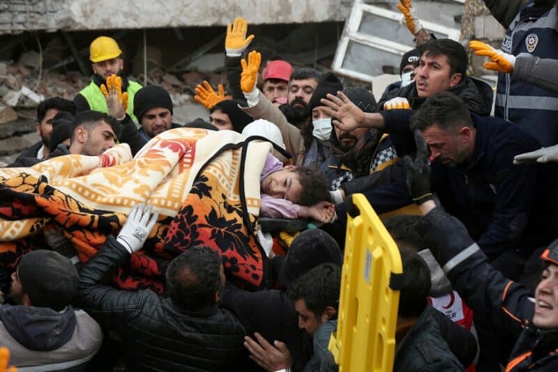 Rescuers carry an injured girl out a a collapsed building following an earthquake in Diyarbakir, Turkey, Feb. 6, 2023. A powerful 7.8 magnitude earthquake rocked areas of Turkey and Syria early that morning, toppling hundreds of buildings and killing more than 2,800 people. (OSV News photo/Sertac Kayar, Reuters)