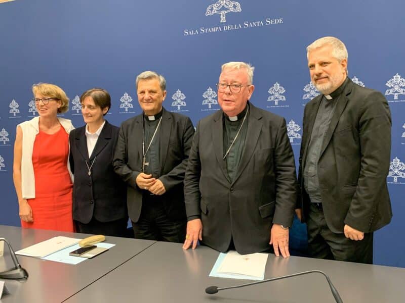 The people who presented the working document for the Synod of Bishops pose for a photo in the Vatican press office June 20, 2023. From the left are Helena Jeppesen-Spuhler, a synod participant from Switzerland; Sister Nadia Coppa, president of the women's International Union of Superiors General; Cardinal Mario Grech, secretary-general of the synod; Cardinal Jean-Claude Hollerich, relator general of the synod; and Jesuit Father Giacomo Costa, a consultant to the synod. (CNS photo/Cindy Wooden)