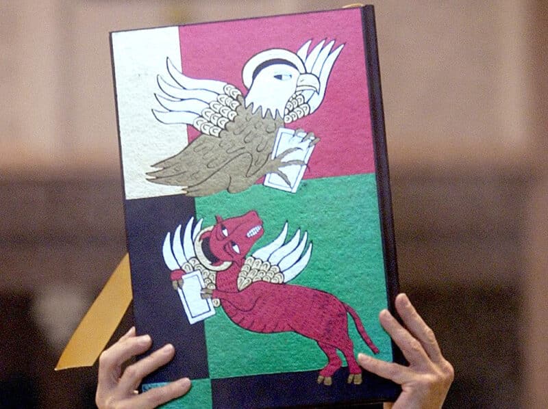 Deacon Gregory Fabian carries the lectionary during a Mass of ordination for new deacons at Holy Angels Cathedral in Gary, Ind., in early June. (CNS photo by Karen Callaway, Northwest Indiana Catholic) (Aug. 5, 2003) See DEACONS Aug. 5, 2003.