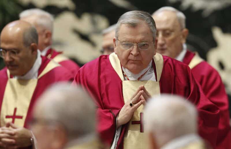 U.S. Cardinal Raymond L. Burke is pictured after receiving Communion during the funeral Mass for Australian Cardinal George Pell in St. Peter's Basilica at the Vatican Jan. 14, 2023. Cardinal Pell, former prefect of the Vatican's Secretariat for the Economy, died Jan. 10 in Rome at the age of 81. (CNS photo/Paul Haring)