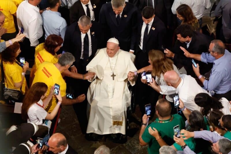 Pope Francis greets the crowd as he leaves after celebrating vespers with Portuguese bishops, priests, deacons, consecrated persons, seminarians and pastoral workers in the Jerónimos Monastery in Lisbon, Portugal, Aug. 2, 2023. (CNS photo/Lola Gomez)