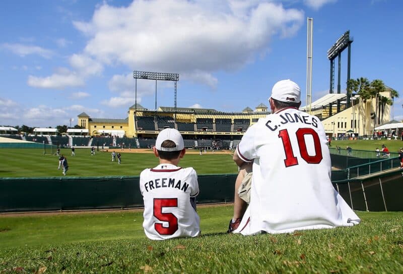A son who sits next to his father while watching the baseball game in Lake Buena Vista, Fla., Marc 4, 2019. (CNS photo/Butch Dill-USA TODAY Sports via Reuters)