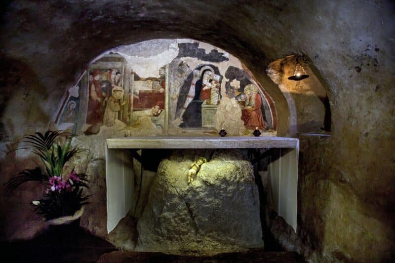 This 2013 file photo shows the fresco of St. Francis of Assisi adoring the baby Jesus in the Chapel of the Nativity in Greccio, Italy. The chapel is built in the grotto that tradition says is where St. Francis arranged the first Nativity scene in 1223. (CNS photo/Octavio Duran)