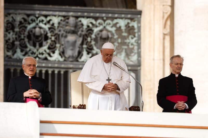 Pope Francis prays during his weekly general audience in St. Peter's Square at the Vatican Oct. 18, 2023. (CNS photo/Lola Gomez)
