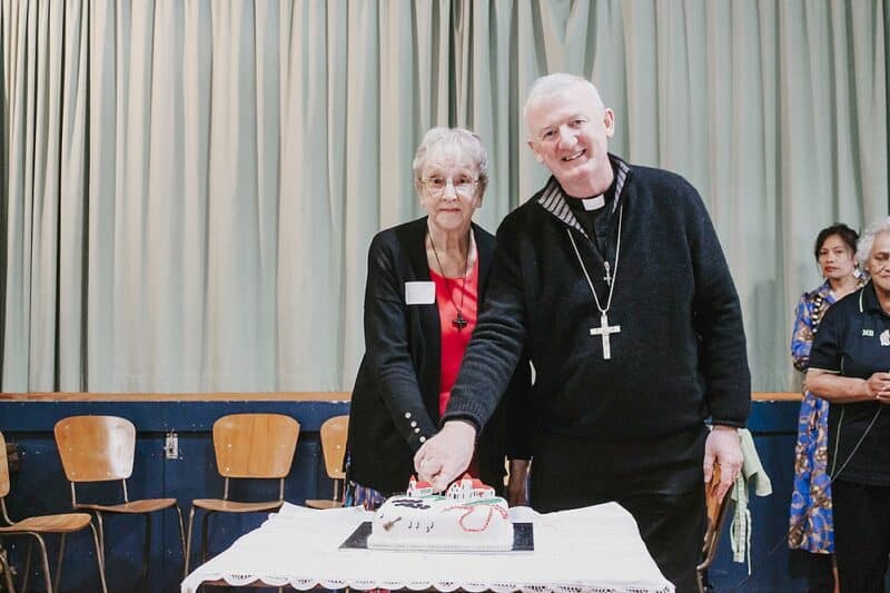 Cutting the jubilee cake were Sr Annette Young, RNDM and Bishop John Adams.