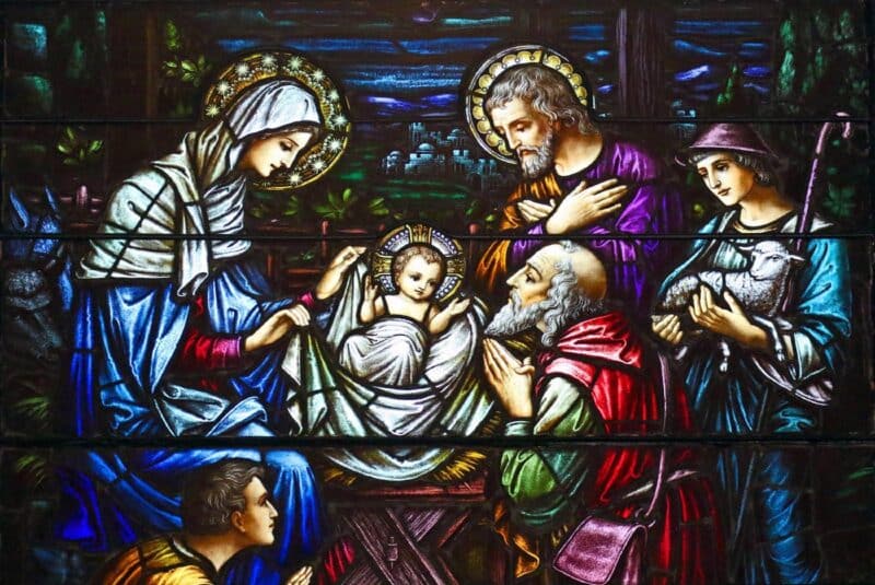 This stained glass window at St. Aloysius Church in Great Neck, N.Y. depicts Jesus in a manger, surrounded by Mary, Joseph and three shepherds. The feast of the Nativity of the Lord is celebrated Dec. 25. (OSV News photo/Gregory A. Shemitz)