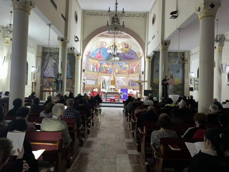 A Divine Liturgy is celebrated at Holy Family Church in Gaza City Dec. 15, 2023, one day before the Latin Patriarchate of Jerusalem said that an Israel Defense Forces sniper shot and killed a mother and daughter as they walked to a convent in the Holy Family Parish compound in Gaza. While avoiding language that directly criticized the IDF, the patriarchate stated that the mother and daughter were "murdered." Seven more people were shot and wounded while trying to protect others in the church compound. (OSV News photo/ courtesy Holy Family Parish) Editors: Best quality available.